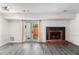 Bright living room with a fireplace, French doors, and modern flooring provides ample space for comfortable living at 732 Jamestown Xing, Jonesboro, GA 30238