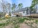 Backyard showcasing a deck, playset, and trampoline for Gathering fun at 841 Butterworth Rd, Canton, GA 30114