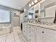 Bright bathroom showcasing double vanity sinks, granite countertop, and white cabinets at 841 Butterworth Rd, Canton, GA 30114