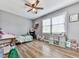 Bedroom featuring hardwood floors, ample natural light, and playful decor at 841 Butterworth Rd, Canton, GA 30114