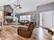 Inviting living room featuring a stone fireplace, vaulted ceilings, and natural light at 841 Butterworth Rd, Canton, GA 30114
