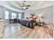 Spacious main bedroom featuring tray ceilings, hardwood floors, and natural light at 841 Butterworth Rd, Canton, GA 30114