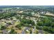 This aerial view showcases the community with lush trees and landscaped yards, offering privacy and curb appeal at 2610 Ginger Dr, Buford, GA 30519