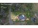 Aerial view of property showcasing the lot size, mature trees, and backyard pool at 2610 Ginger Dr, Buford, GA 30519