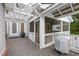 Large back deck featuring wooden pergola, screened-in porch, and a grill at 2610 Ginger Dr, Buford, GA 30519