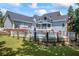 Expansive backyard featuring a refreshing pool and a charming screened-in porch, perfect for outdoor entertaining at 2610 Ginger Dr, Buford, GA 30519