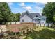 This backyard offers a basketball hoop, and a refreshing pool creating an ideal space for Gathering fun and entertainment at 2610 Ginger Dr, Buford, GA 30519