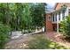 An expansive backyard with a paved driveway and mature trees, offering both convenience and natural beauty at 2610 Ginger Dr, Buford, GA 30519