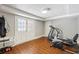 Spacious basement with wooden floors, white doors and a treadmill at 2610 Ginger Dr, Buford, GA 30519