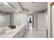 Bathroom features a large mirror, double vanity, and a door leading to an adjoining room at 2610 Ginger Dr, Buford, GA 30519