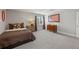Bedroom featuring neutral walls, carpet floors, and an American flag wall hanging at 2610 Ginger Dr, Buford, GA 30519