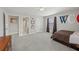 Bedroom with neutral walls, carpet, and a door that leads to a bathroom at 2610 Ginger Dr, Buford, GA 30519