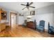 Bonus room with hardwood floors, elegant trim, built in desk, and classic furnishings at 2610 Ginger Dr, Buford, GA 30519