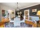 Inviting dining room featuring a round table, hardwood floors, and stylish wall decor at 2610 Ginger Dr, Buford, GA 30519