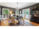 Charming dining room with a modern chandelier, hardwood floors, and eclectic decorations at 2610 Ginger Dr, Buford, GA 30519