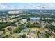 Beautiful home exterior with multilevel deck shown from aerial view of landscaped lawn, trees, and community at 2610 Ginger Dr, Buford, GA 30519