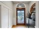 Elegant foyer featuring a decorative front door with glass detailing, hardwood floors, and classic trim at 2610 Ginger Dr, Buford, GA 30519