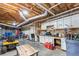 Spacious garage/workshop with an exposed ceiling, tool bench and ample storage at 2610 Ginger Dr, Buford, GA 30519