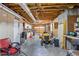 Spacious garage/workshop with exposed ceiling and large roll-up doors at 2610 Ginger Dr, Buford, GA 30519