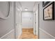Hallway with light gray walls and hardwood floors, plus nice white trim at 2610 Ginger Dr, Buford, GA 30519