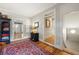Traditional hallway with hardwood floors, red Persian rug, and decorative wall art at 2610 Ginger Dr, Buford, GA 30519