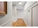 Hallway with light gray walls, white trim, and lovely hardwood floors at 2610 Ginger Dr, Buford, GA 30519