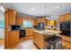 Spacious kitchen with granite countertops, stainless steel appliances, and an island with seating at 2610 Ginger Dr, Buford, GA 30519