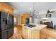 Well-equipped kitchen featuring granite countertops, stainless appliances, island with cooktop and seating at 2610 Ginger Dr, Buford, GA 30519