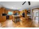 Spacious kitchen featuring custom wood cabinetry, granite countertops, and a central island with seating at 2610 Ginger Dr, Buford, GA 30519