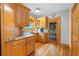 Kitchen with wooden cabinets, granite countertops, stainless steel sink, and wine storage at 2610 Ginger Dr, Buford, GA 30519