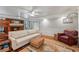 Spacious room with cozy sofa, exposed brick fireplace, bunkbeds, and lots of natural light at 2610 Ginger Dr, Buford, GA 30519