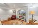 Cozy living room featuring neutral colors, modern lighting, and a vintage leather chair at 2610 Ginger Dr, Buford, GA 30519