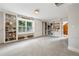 Bright living room with built-in bookshelves and storage at 2610 Ginger Dr, Buford, GA 30519