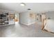 Bright loft area features custom built-in bookshelves and is illuminated with recessed lights and natural light at 2610 Ginger Dr, Buford, GA 30519