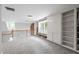 Loft featuring custom built-in bookshelves and storage spaces and window seating with great natural light at 2610 Ginger Dr, Buford, GA 30519