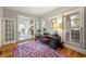 Home office featuring neutral colors, hardwood floors, and comfortable furniture at 2610 Ginger Dr, Buford, GA 30519