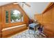 Cozy office in a nook setting with a large window, desk, custom paneling and ceiling fan at 2610 Ginger Dr, Buford, GA 30519