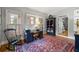 Home office with neutral walls, hardwood floors, and a vintage rug at 2610 Ginger Dr, Buford, GA 30519