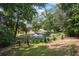 Expansive green backyard featuring a picturesque pond with a fountain, creating a serene and scenic retreat at 2610 Ginger Dr, Buford, GA 30519