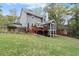 Backyard with a deck, screened-in porch, and large grassy area at 2811 Shady Valley Ne Dr, Brookhaven, GA 30324