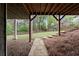 View of a beautiful backyard with a stone path, stairs, trees, and covered patio at 2811 Shady Valley Ne Dr, Brookhaven, GA 30324
