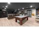 Finished basement with a pool table, theater seating, bar, and entertainment area at 2811 Shady Valley Ne Dr, Brookhaven, GA 30324
