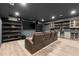 Finished basement theater seating area with black entertainment center and bar at 2811 Shady Valley Ne Dr, Brookhaven, GA 30324