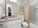 Charming bathroom with white vanity, marble countertops, and a shower-tub combo at 2811 Shady Valley Ne Dr, Brookhaven, GA 30324