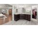 Bathroom with double vanities and doorway views into main bedroom and walk-in closet at 2811 Shady Valley Ne Dr, Brookhaven, GA 30324