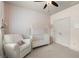 Bedroom with crib, white walls with tasteful floral print, chair, and closet at 2811 Shady Valley Ne Dr, Brookhaven, GA 30324