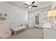 Bedroom features a crib, bookshelf, and a plush chair with a window view at 2811 Shady Valley Ne Dr, Brookhaven, GA 30324
