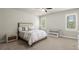 Bedroom featuring neutral colors, light carpet, a ceiling fan, and natural light at 2811 Shady Valley Ne Dr, Brookhaven, GA 30324