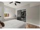 Bedroom with window seat, ceiling fan, and view of the workout room at 2811 Shady Valley Ne Dr, Brookhaven, GA 30324
