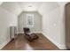 Cozy bonus room with hardwood floors, a comfortable chair, and a window for natural light at 2811 Shady Valley Ne Dr, Brookhaven, GA 30324